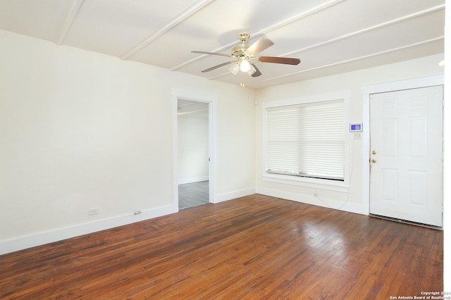 spare room featuring ceiling fan and dark hardwood / wood-style floors