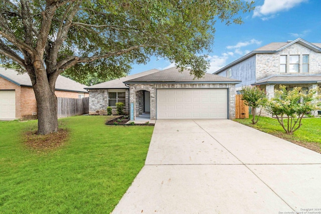 view of front of house featuring a garage and a front yard