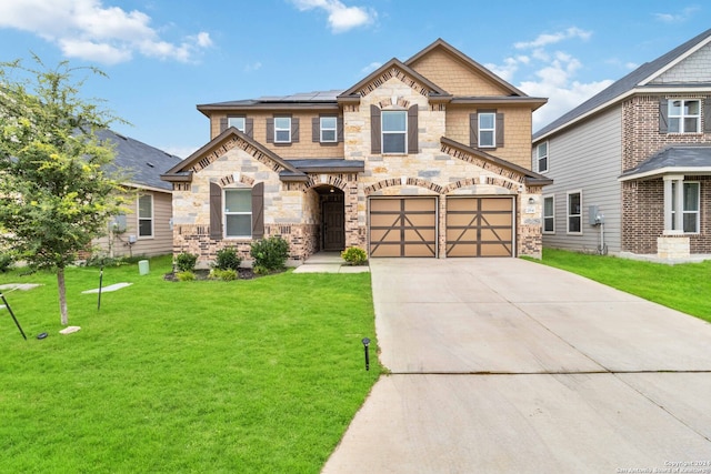 craftsman house featuring a garage and a front lawn