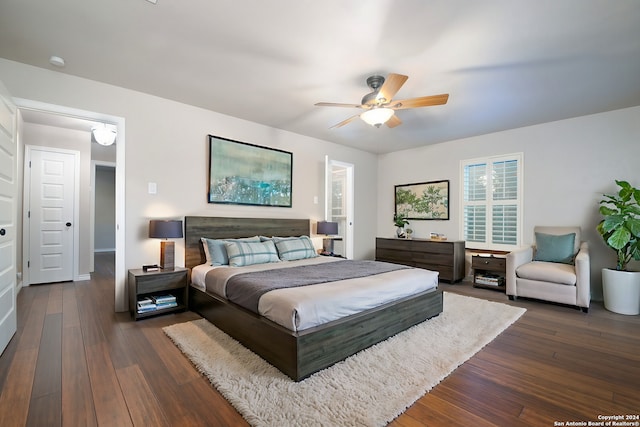 bedroom with dark wood-type flooring and ceiling fan