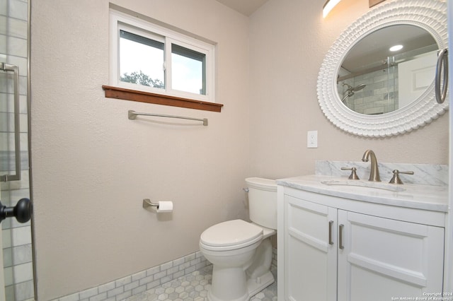 bathroom featuring vanity, toilet, tile patterned flooring, and a shower