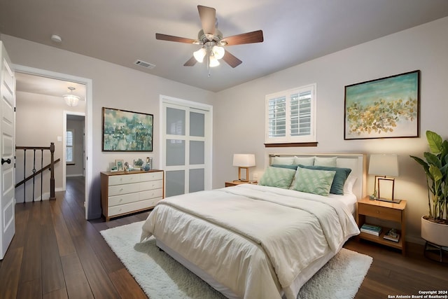 bedroom with ceiling fan and dark hardwood / wood-style flooring