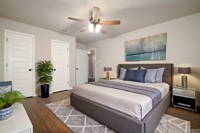 bedroom featuring dark wood-type flooring and ceiling fan