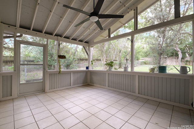 unfurnished sunroom with vaulted ceiling and ceiling fan