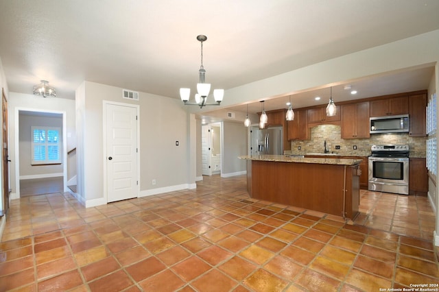 kitchen with pendant lighting, decorative backsplash, a chandelier, and appliances with stainless steel finishes