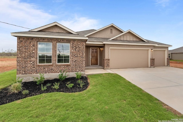 view of front facade with a garage and a front yard