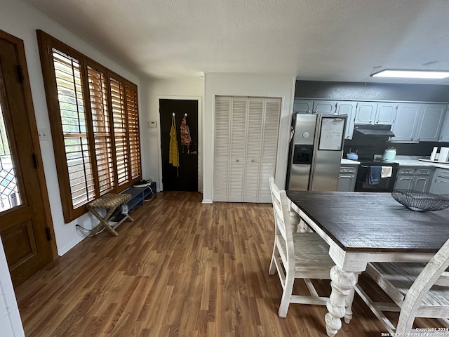 dining room with dark hardwood / wood-style flooring