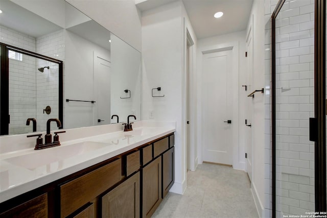 bathroom with vanity, tile patterned floors, and walk in shower