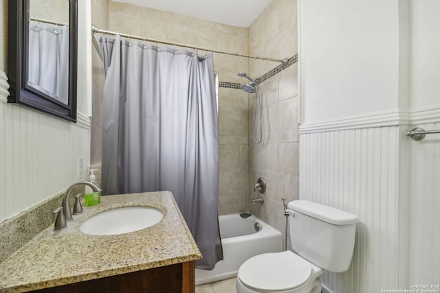 full bathroom featuring vanity, toilet, and shower / tub combo