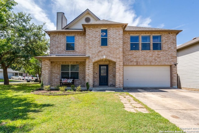 view of front facade featuring a garage and a front yard