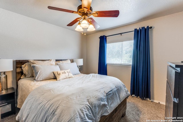 carpeted bedroom with ceiling fan