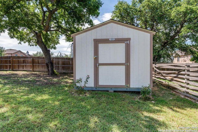 view of outbuilding with a yard