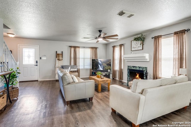 living room featuring plenty of natural light and dark hardwood / wood-style floors