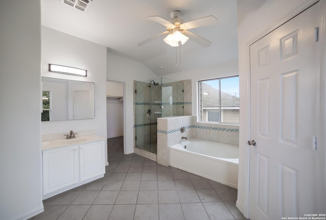 bathroom featuring shower with separate bathtub, vaulted ceiling, tile patterned flooring, vanity, and ceiling fan