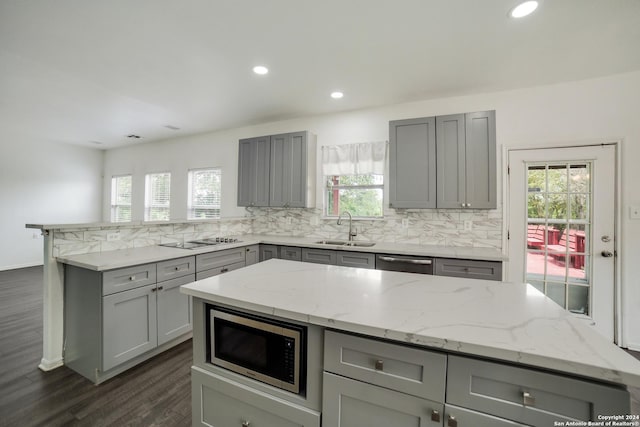 kitchen featuring sink, gray cabinets, and stainless steel appliances