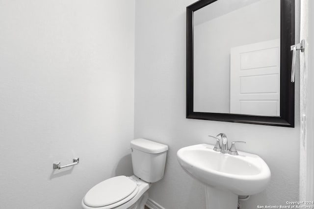 bathroom featuring sink and toilet