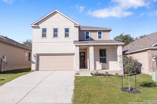 front facade with a front yard and a garage