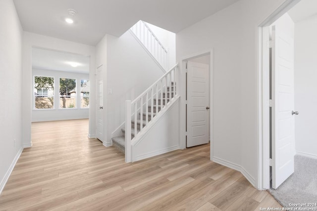 stairway featuring hardwood / wood-style floors