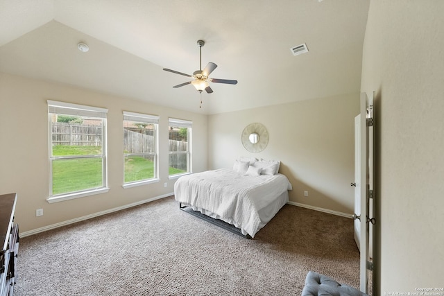 bedroom featuring lofted ceiling, carpet floors, and ceiling fan