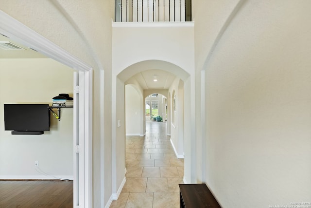 hallway with light tile patterned floors