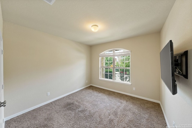 unfurnished room featuring carpet floors