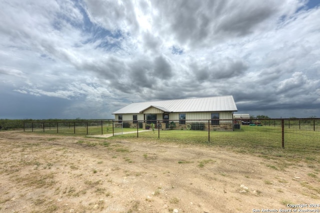 exterior space with a rural view