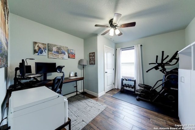 office featuring a textured ceiling, hardwood / wood-style floors, and ceiling fan