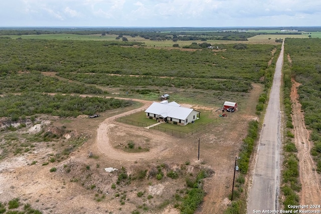 birds eye view of property featuring a rural view