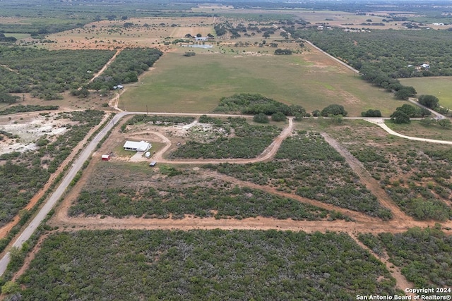 birds eye view of property featuring a rural view