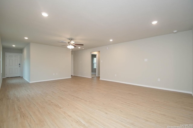 empty room featuring light hardwood / wood-style floors and ceiling fan