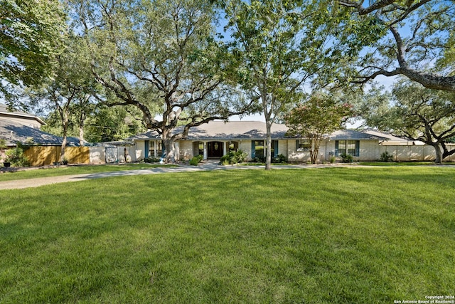 ranch-style house with a front yard