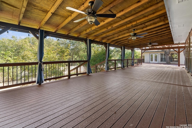 wooden deck featuring french doors and ceiling fan