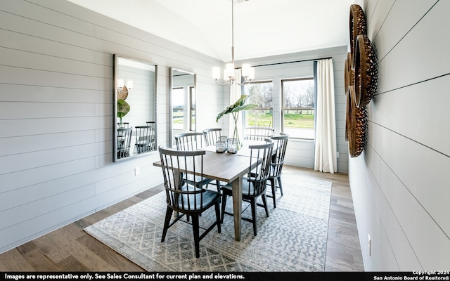 dining room with an inviting chandelier and hardwood / wood-style floors