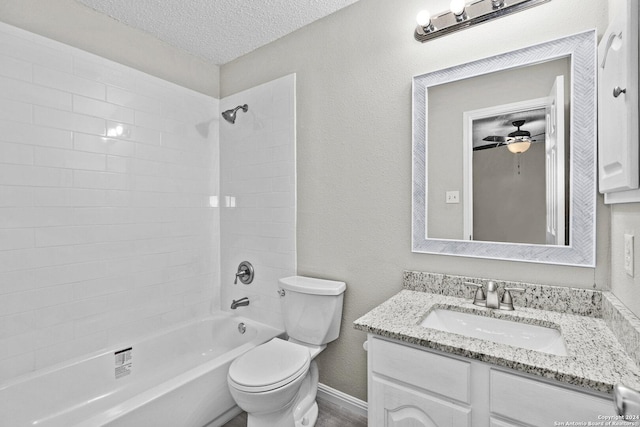 full bathroom featuring vanity, a textured ceiling, toilet, a textured wall, and shower / bathtub combination