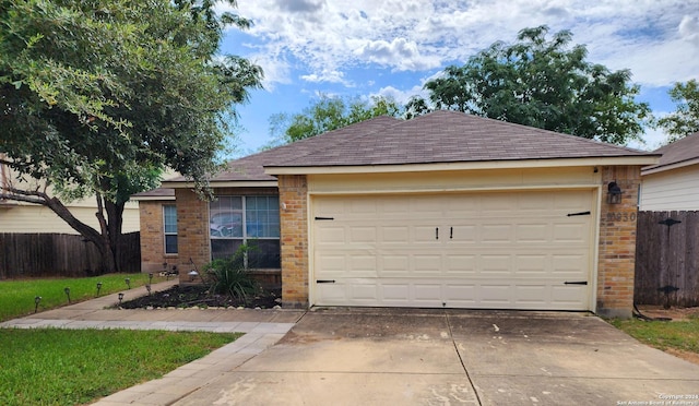 single story home with a garage