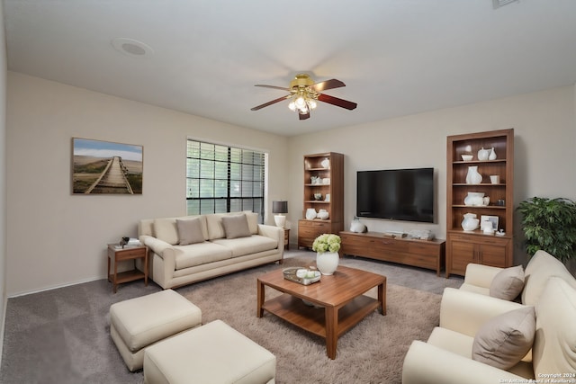 living room featuring light colored carpet and ceiling fan