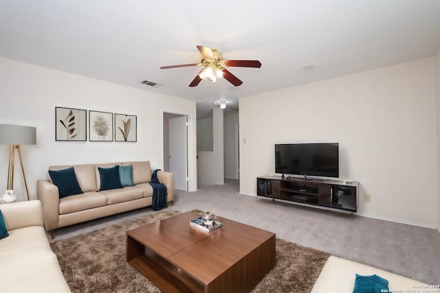 living room with carpet floors and ceiling fan