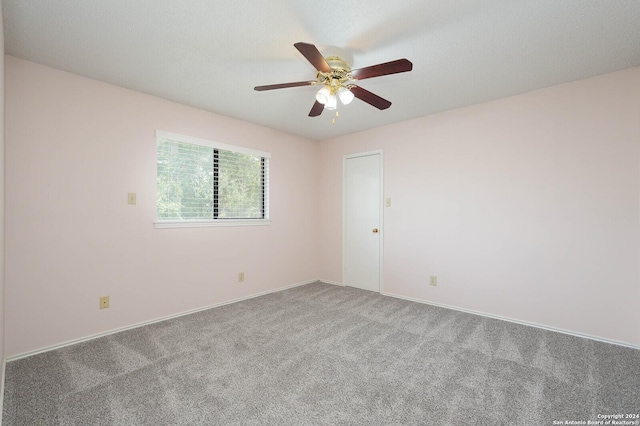 carpeted empty room with ceiling fan