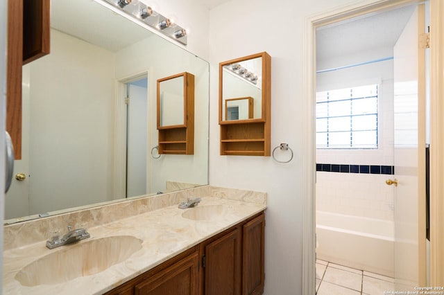 bathroom with vanity, a bathtub, and tile patterned floors