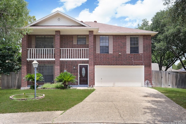 view of front facade with a garage and a front lawn