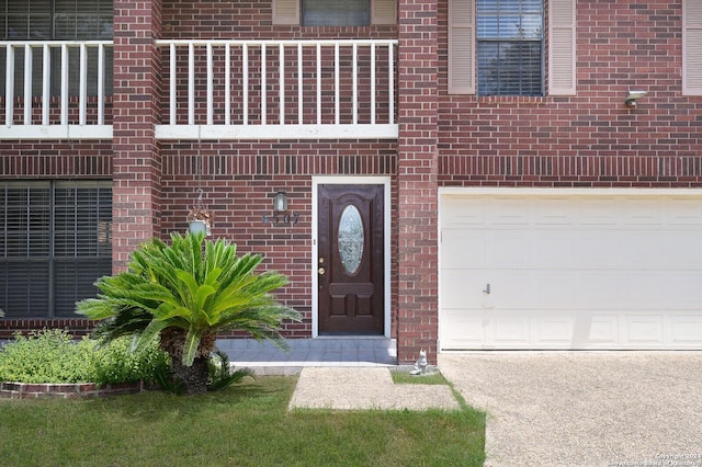 view of exterior entry featuring a garage