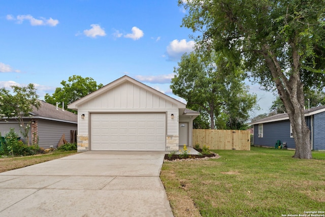 ranch-style house with a front lawn, fence, board and batten siding, and stone siding