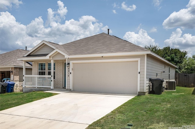 ranch-style home with a garage, central AC, a front lawn, and a porch