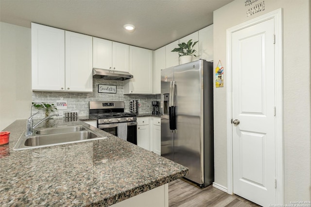 kitchen featuring sink, light hardwood / wood-style flooring, stainless steel appliances, and white cabinets