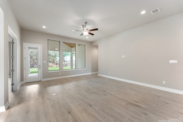 unfurnished room featuring ceiling fan and light wood-type flooring