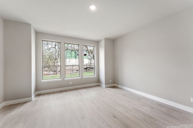 spare room featuring light wood-type flooring