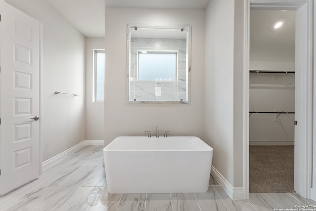 bathroom featuring a washtub