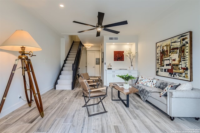 living room featuring ceiling fan