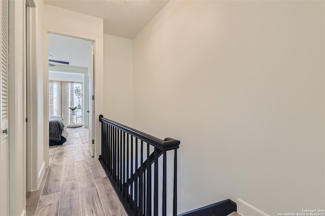 corridor with light wood-type flooring