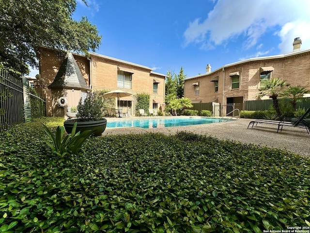 view of swimming pool with a patio